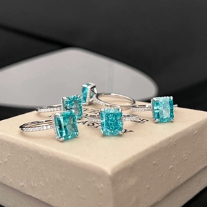 Luxury 925 sterling silver ring set with emerald cut paraiba gemstones and diamonds