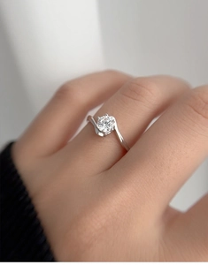 Macro shot of S925 sterling silver moissanite ring with a twisted band design