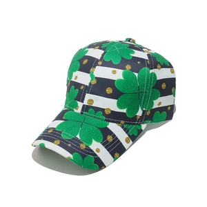 Detail of St. Patrick's Day baseball cap with green clover print and gold glitter dots