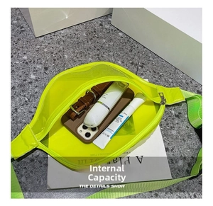 Detail view of transparent neon green crossbody waist bag showing large interior capacity