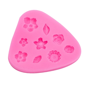 Pink silicone mold featuring mini 3D flowers and leaves for fondant and resin art