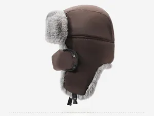 Detail of dark brown winter trapper hat with thick grey faux fur lining and buckle