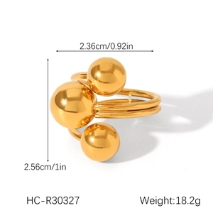 Macro shot of gold sphere ring with dimensions 2.36cm by 2.56cm and double-line band