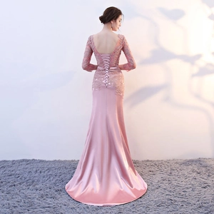 Elegant pink lace mermaid evening dress with open back and corset tie detail