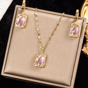 Gold chain necklace and earrings set with rectangular pink crystal zircon pendants