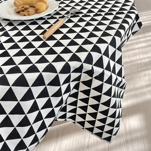 Detailed view of black and white geometric triangle pattern on thick cotton linen tablecloth