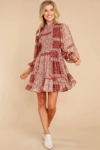 Close-up of shirred bodice and paisley pattern on a bohemian long-sleeved dress