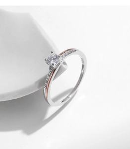 Macro detail of S925 sterling silver stamp and sparkling diamond on rose gold ring