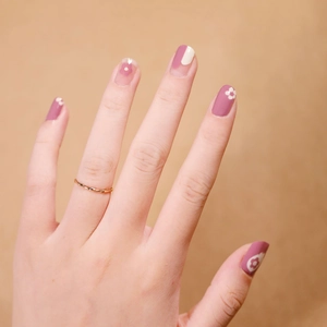 Pink and purple heart nail stickers with white flower patterns and a gold ring