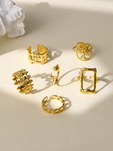 Set of six gold plated vintage rings featuring Tree of Life and celestial designs