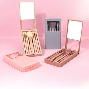 Five-piece mini portable makeup brush set in a compact storage box with a built-in mirror