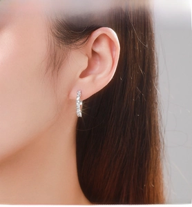Close-up of S925 sterling silver hoop earrings with shimmering pavé zircon stones