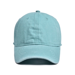 Detail view of teal washed cotton baseball cap with six-panel design and stitched brim