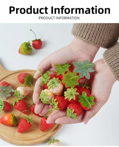 Detailed view of realistic artificial strawberry models in varied ripeness and green stems
