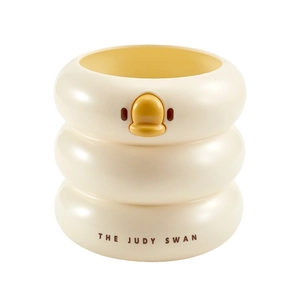 Cute yellow duck cylindrical desk organizer for pens and stationery on white background