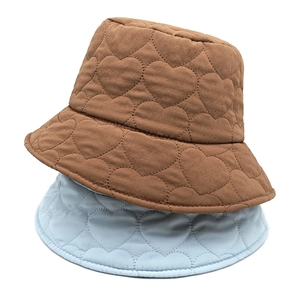 Quilted heart pattern bucket hats for women in brown and blue, perfect for autumn and winter