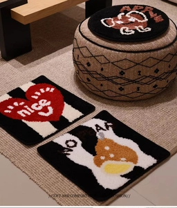Close-up of thick flocked seat cushions with cartoon fruit patterns on a soft textured rug