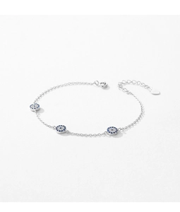 Detailed close-up of S925 sterling silver evil eye bracelet with blue and clear crystals
