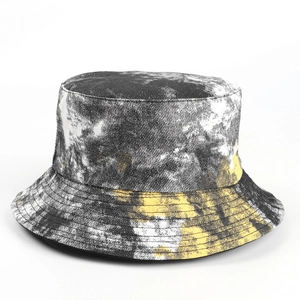 Detail of colorful tie-dye bucket hat showing stitching and cotton fabric texture