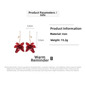 Detail view of red flower long drop earrings with dimensions 9.5cm height and 5.5cm width