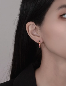 Close-up of model wearing 3mm colorful gradient zircon hoop earrings in gold finish