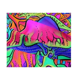 Close-up of vibrant bohemian tapestry fabric with abstract psychedelic patterns