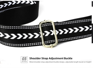 Detail of adjustable black woven strap with white geometric pattern and gold hardware