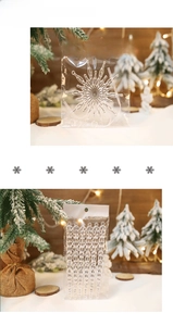 Detailed view of clear acrylic Christmas snowflake and icicle ornaments in packaging