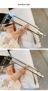 Close-up of frameless rectangle sunglasses with metal rivets and anti-blue light lenses