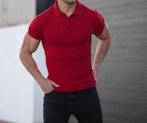 Detail of red vertical rib knit fabric texture on men's slim fit polo shirt