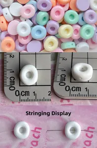 Mini 1cm donut resin beads in macaron colors showing diameter size and stringing detail