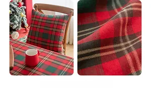 Detail of red and green plaid Christmas tablecloth and matching festive pillow set