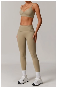 Front view of women's khaki yoga set with V-neck sports bra and high-waist leggings
