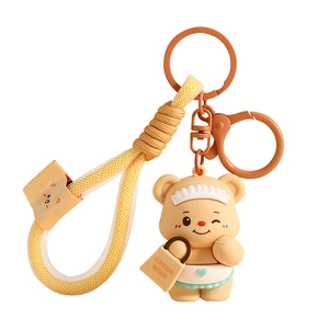 Cute Butter Bear silicone keychain with yellow braided lanyard and small paper bag charm