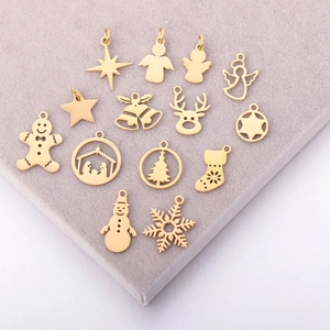 Set of 15 gold stainless steel Christmas charms including reindeer, snowman and tree
