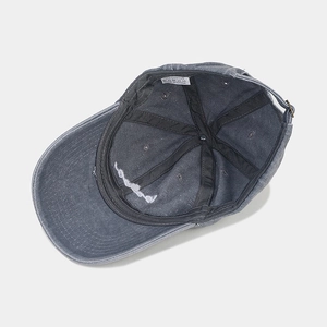 Internal view of washed cotton baseball cap showing 100% cotton label and stitching