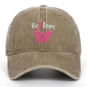 Detail of embroidered Believe text with pink ribbon and butterfly on washed khaki cap