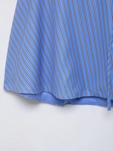 Detail of blue and white striped fabric showing clean stitching and smooth lining