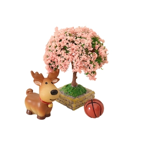 Miniature dollhouse set with a pink cherry blossom tree, a brown deer, and a small basketball