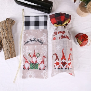 Christmas gnome wine bottle gift bags with buffalo plaid trim and festive holiday greetings