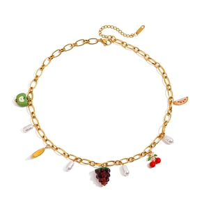 Gold stainless steel necklace with colorful fruit charms and pearls on white background