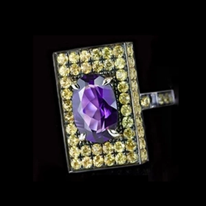 Macro shot of rectangular ring with large purple oval gem and yellow pavé stones