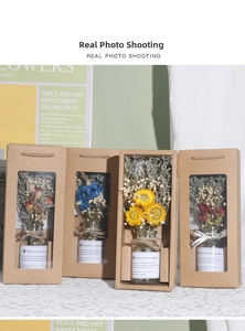 Set of four mini glass flower vases in kraft gift boxes for home decoration props