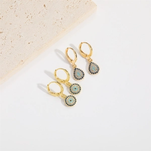 Golden Evil Eye hoop earrings with blue crystal inlay and water drop charm
