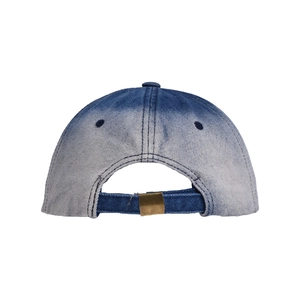 Detail view of denim baseball cap back with vintage metal buckle and gradient wash texture