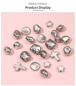 Macro view of silver CCB irregular beads including cross and star shapes for DIY jewelry