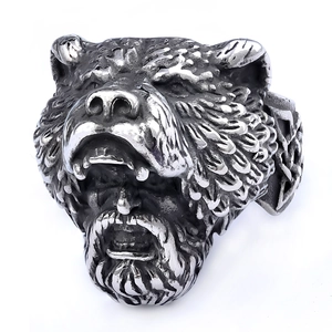 Detailed macro view of retro stainless steel Viking berserker wolf and bear head ring