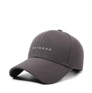 Detail of dark grey twill cotton baseball cap with white norason letter embroidery