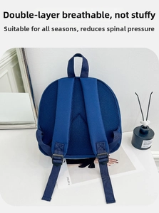 Detail of blue kids backpack featuring double breathable mesh back and padded straps
