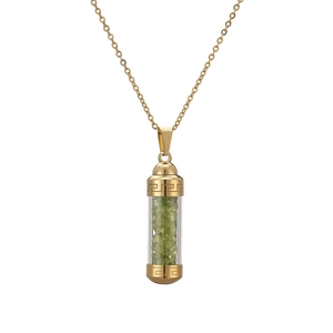 Detail of gold perfume bottle pendant with green crystals and Greek key pattern